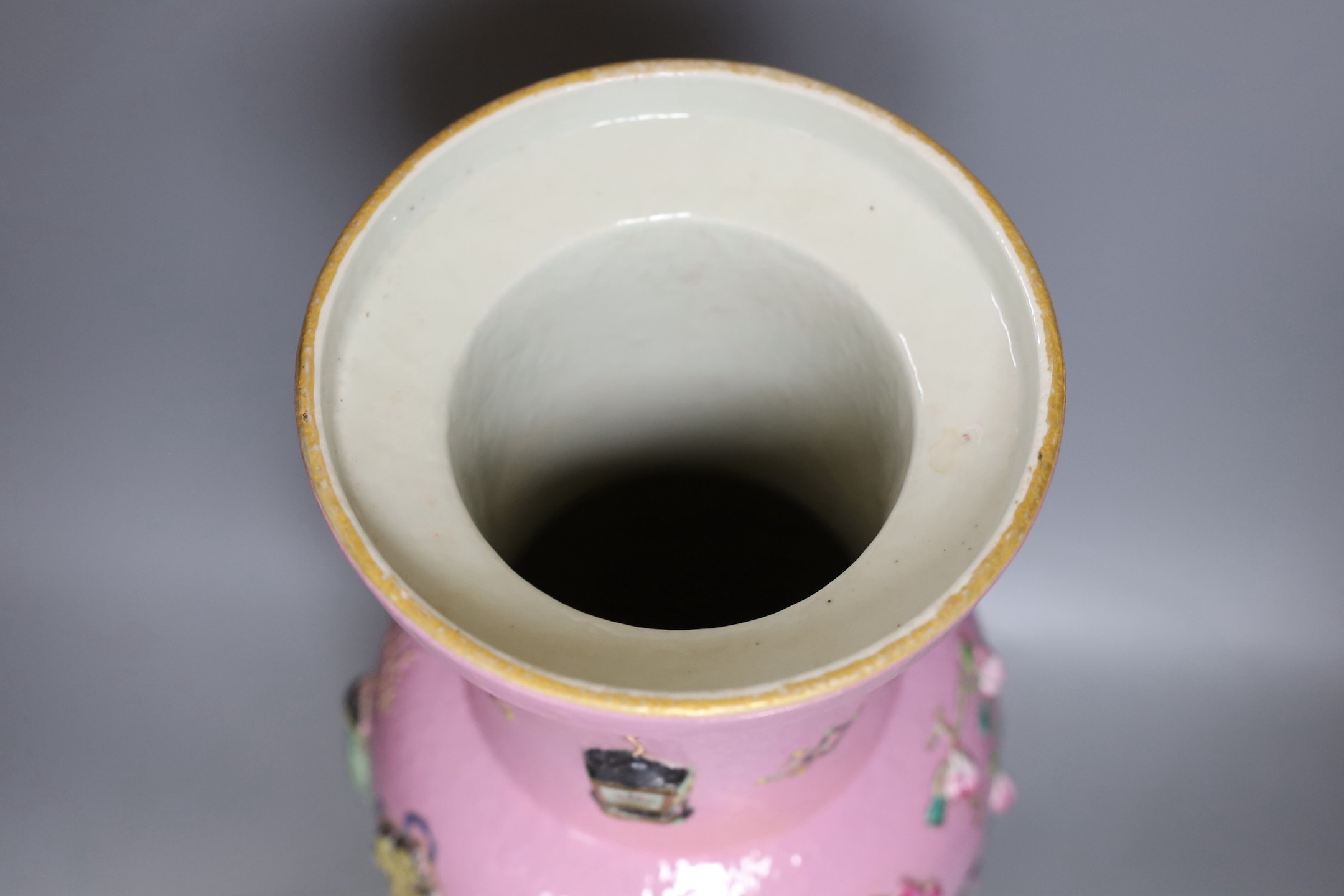 A large Chinese pink ground ‘Hundred Antiques’ vase, 49 cms high.